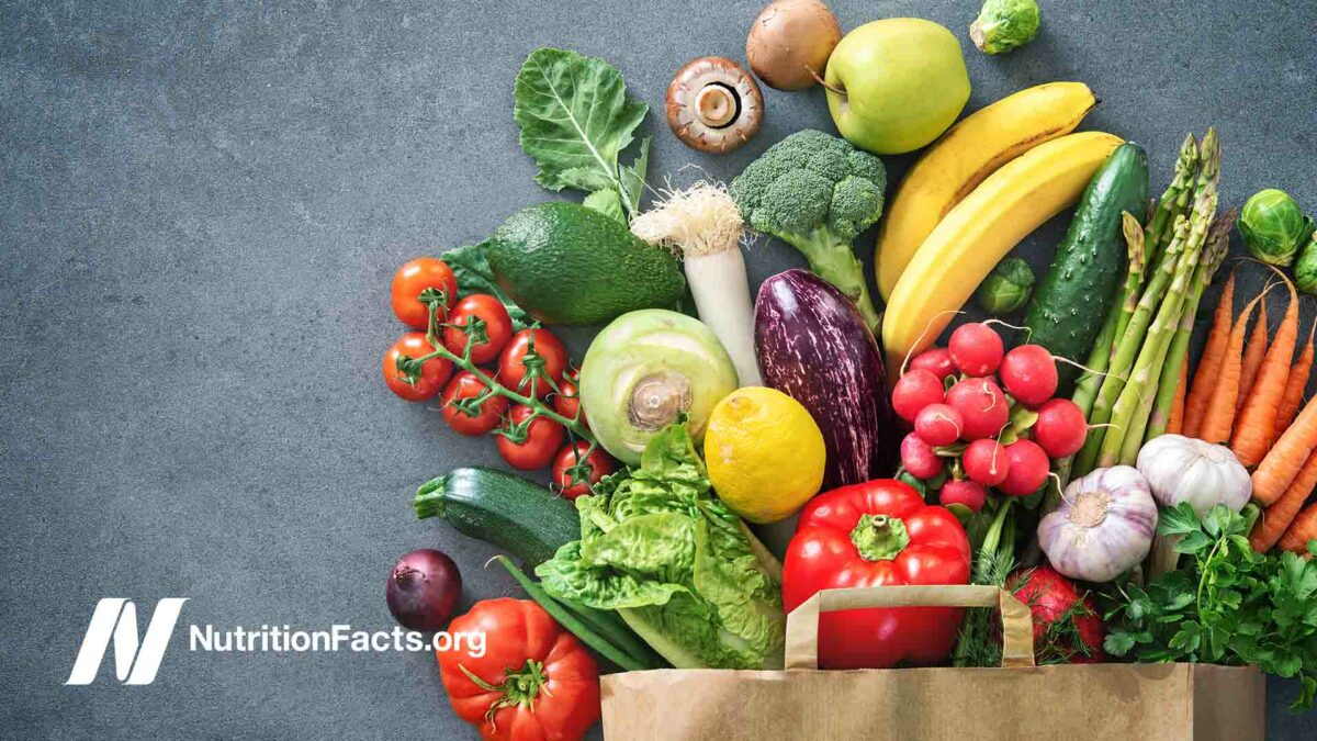 colorful fruit and vegetables on a slate background