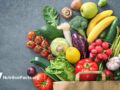 colorful fruit and vegetables on a slate background