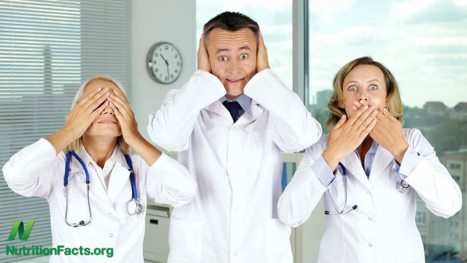 three doctors lined up: one covering their eyes, one covering their ears, and one covering their mouth