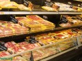 grocery store shelves of packaged meat