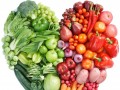 various fruits and vegetables arranged into a heart shape