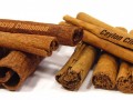 a stack of cassia cinnamon alongside a stack of ceylon cinnamon