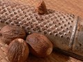 whole nutmeg and a microplane