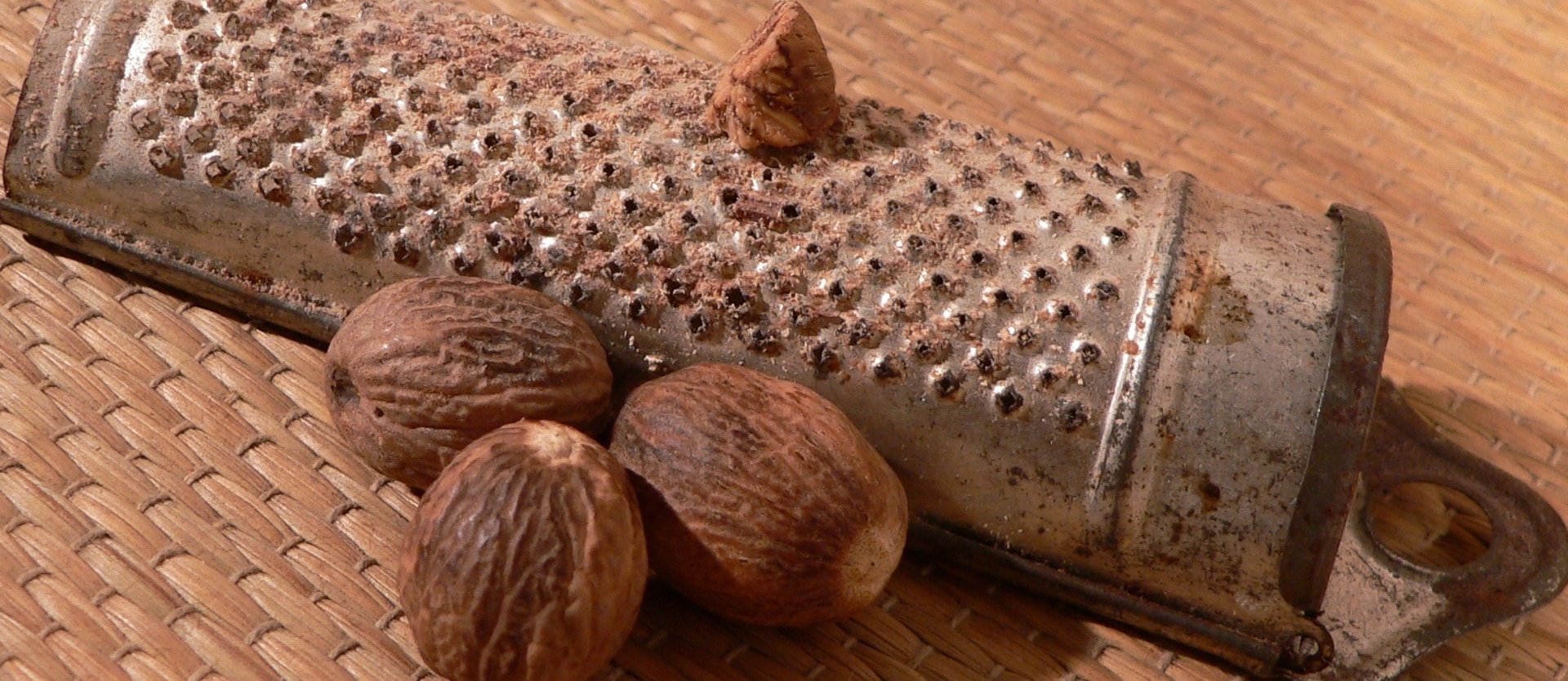 whole nutmeg and a microplane