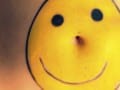 smiley face drawing over a person's midsection