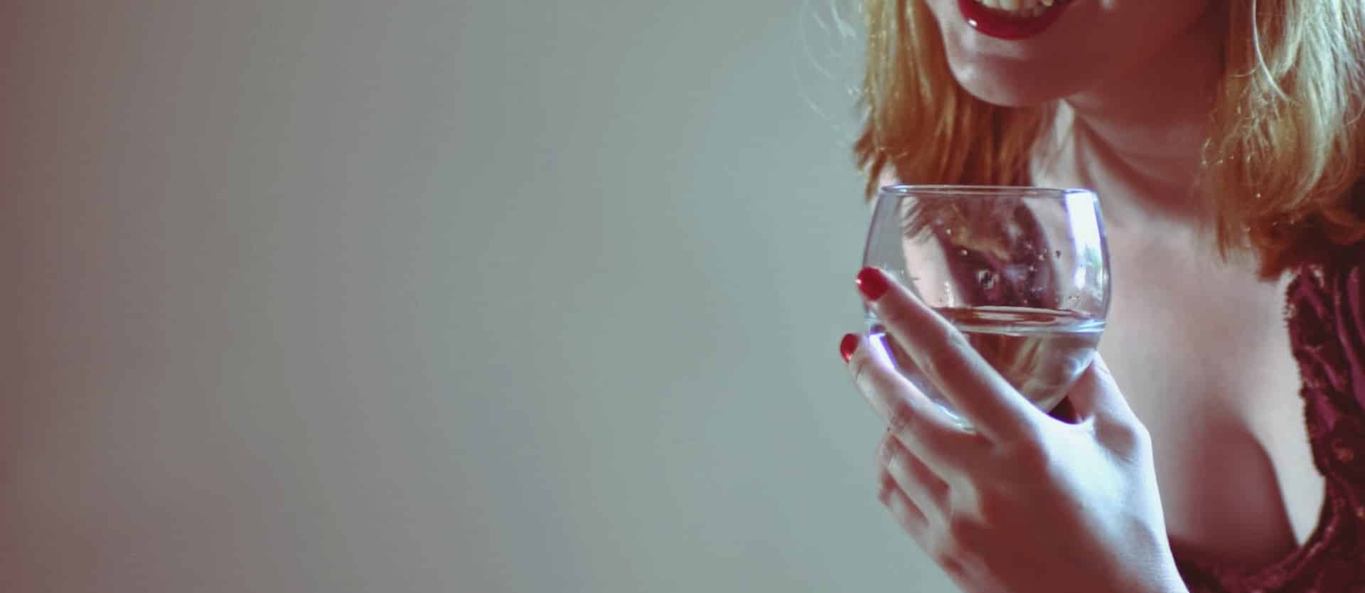 person holding a glass of wine