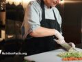 person chopping vegetables