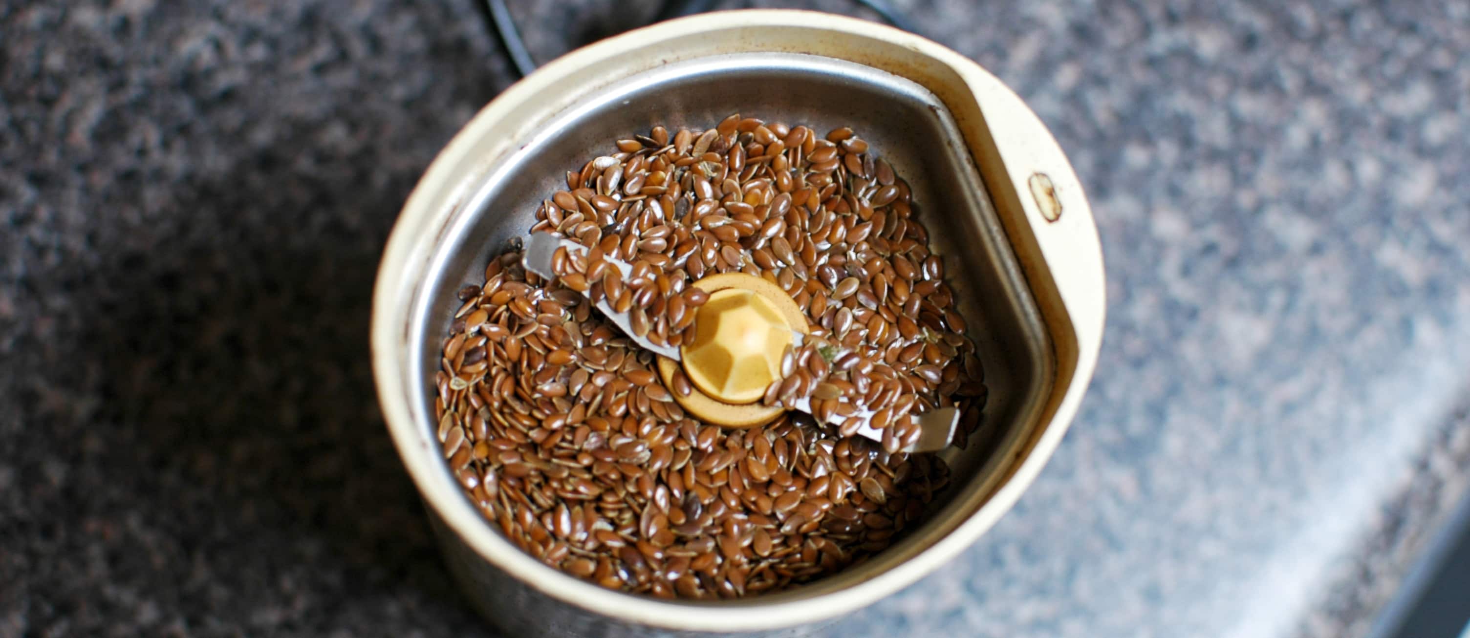 Coffee grinder filled with flaxseeds