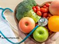 fruits and veggies in heart-shaped bowl with stethoscope