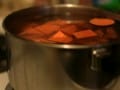 pot filled with water and chopped sweet potatoes