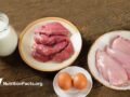 raw meats, eggs, and milk on a table