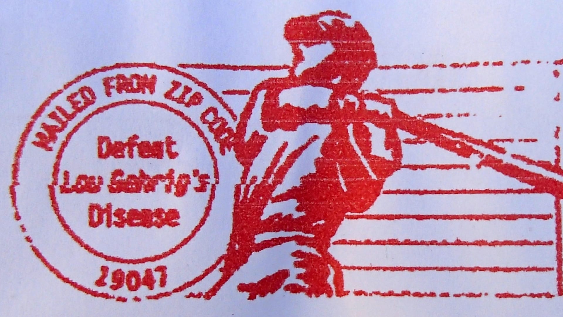 close-up of a postal stamp saying "defeat Lou Gehrig's disease"