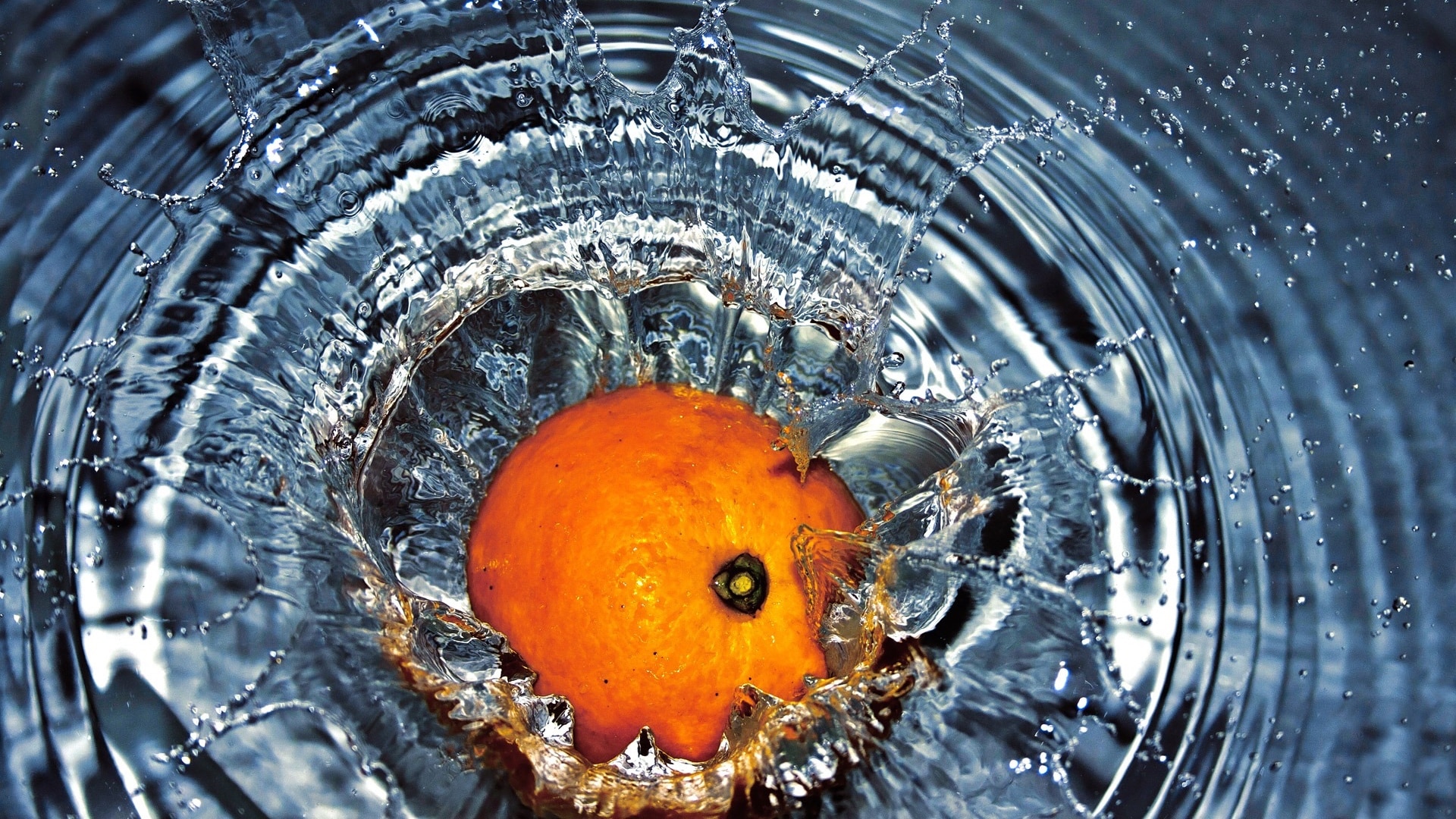 orange splashing in water