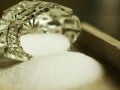 glass jar on its side with salt spilling out