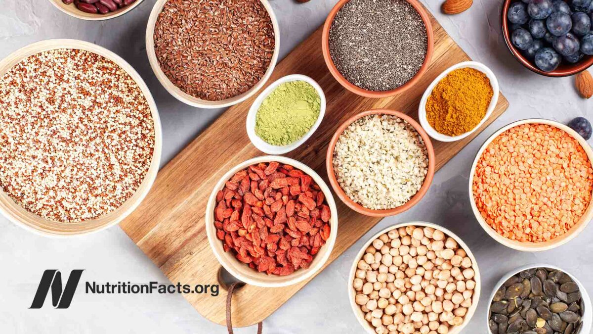 bowls of various whole grains, legumes, seeds, and fruits