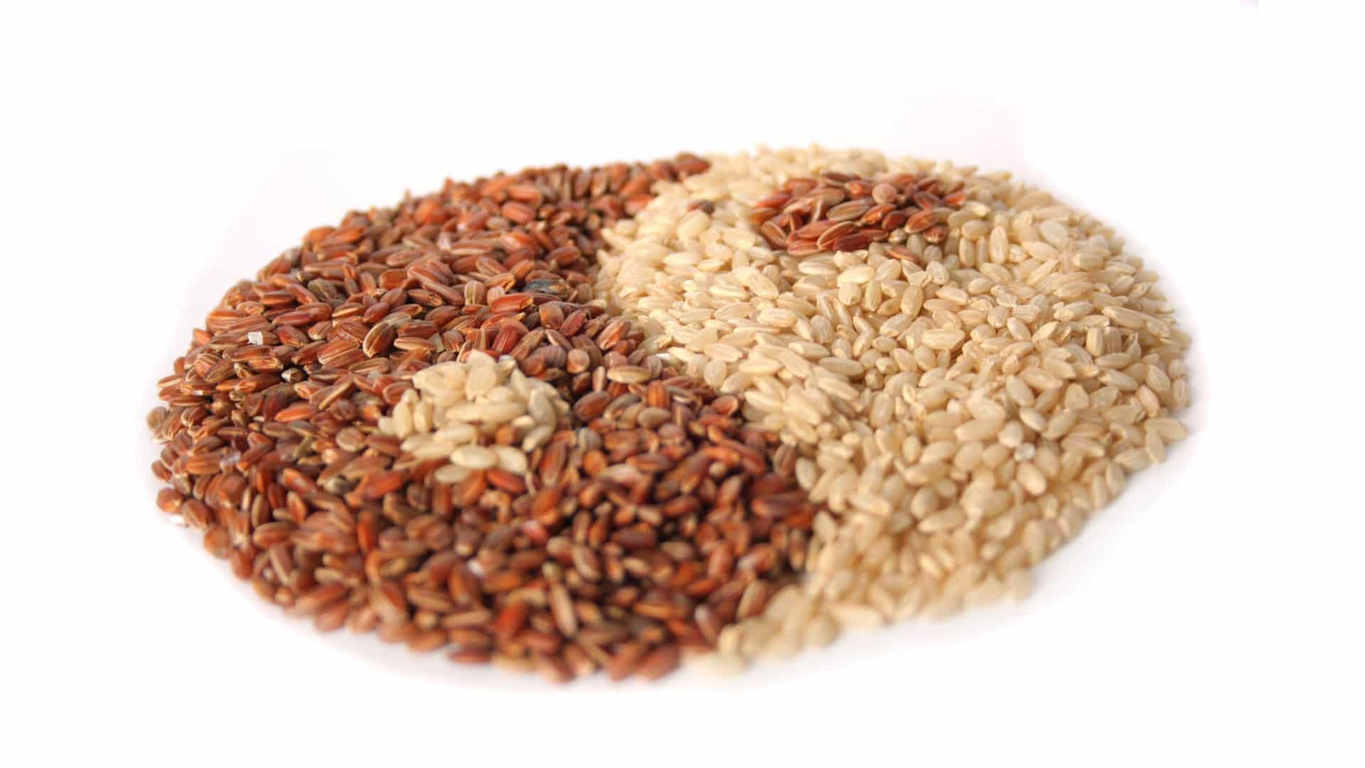 brown and white rice arranged into a yin yang symbol