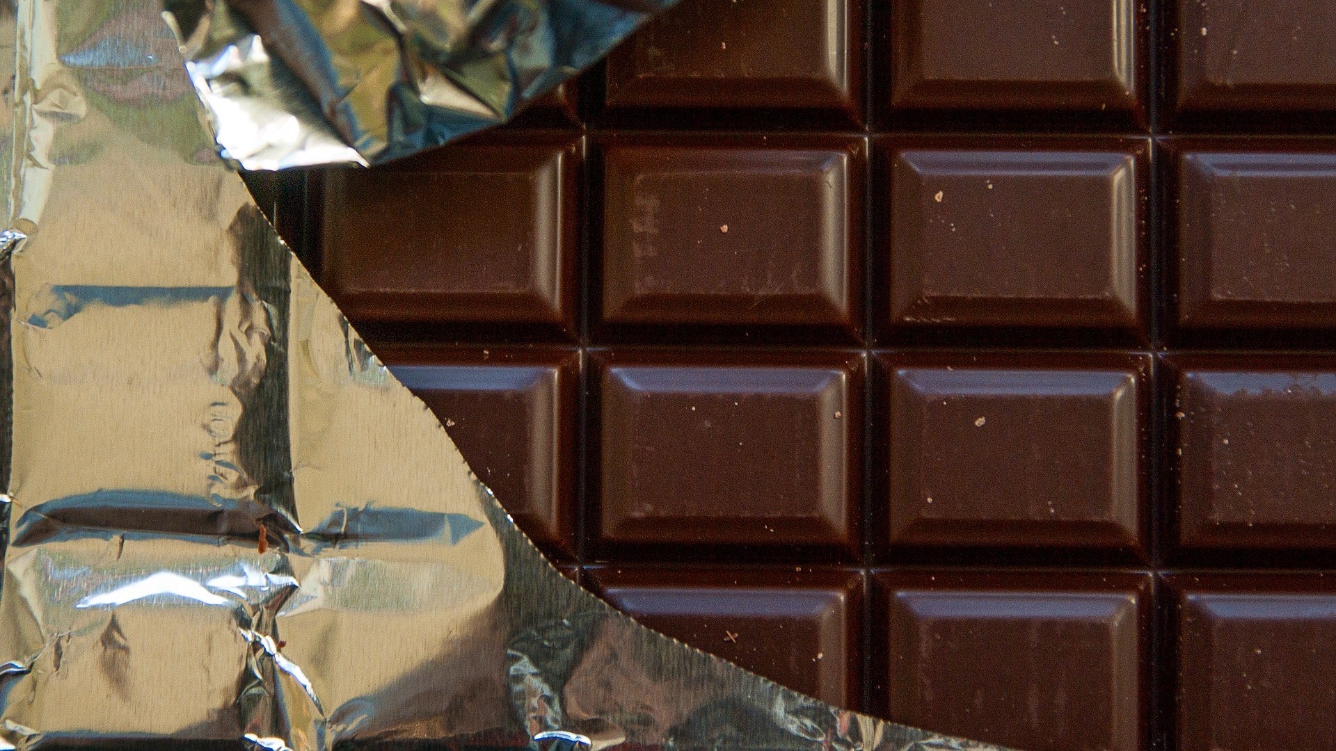 partially unwrapped bar of chocolate