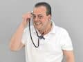 person holding stethoscope to their head