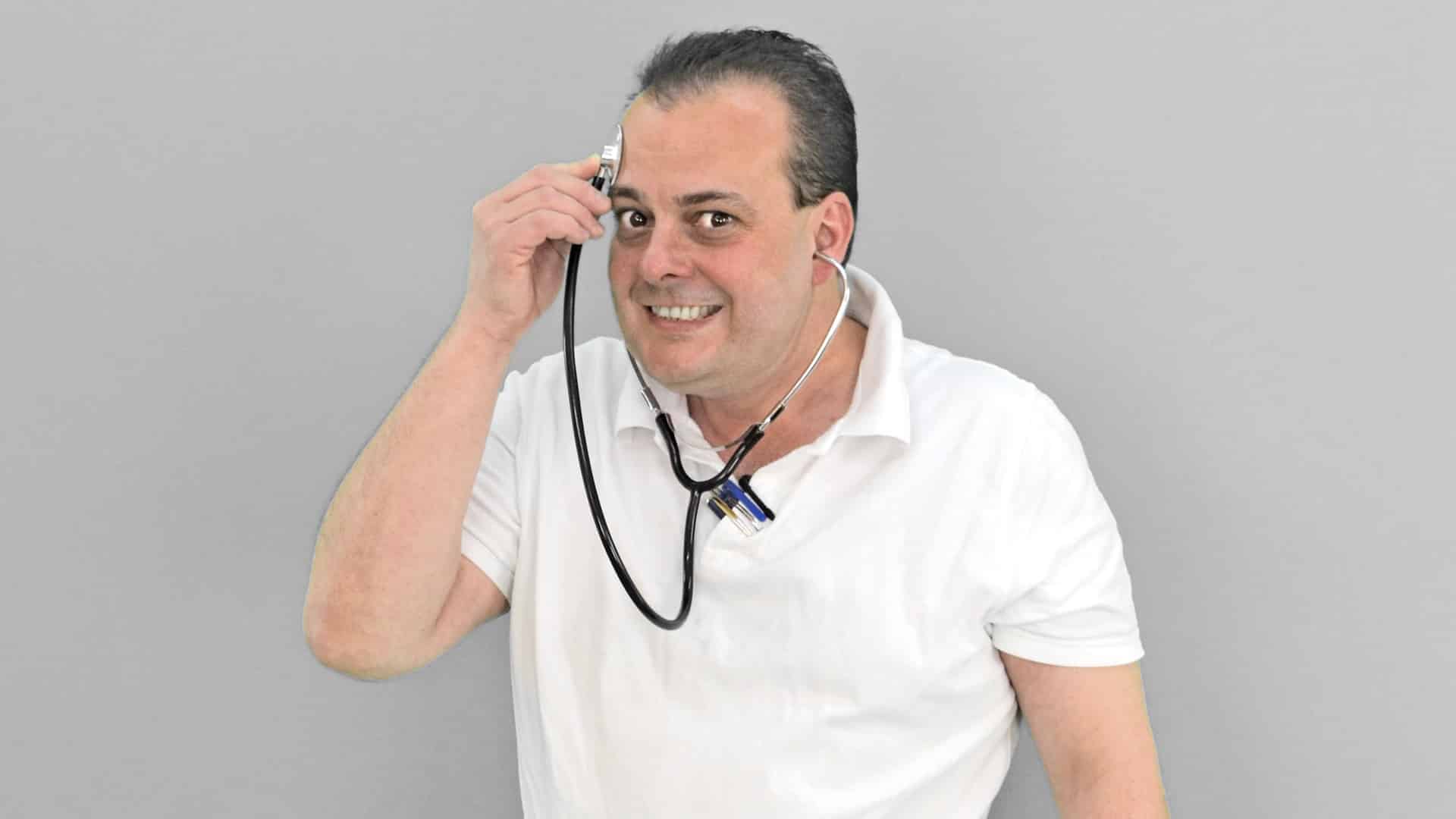 person holding stethoscope to their head