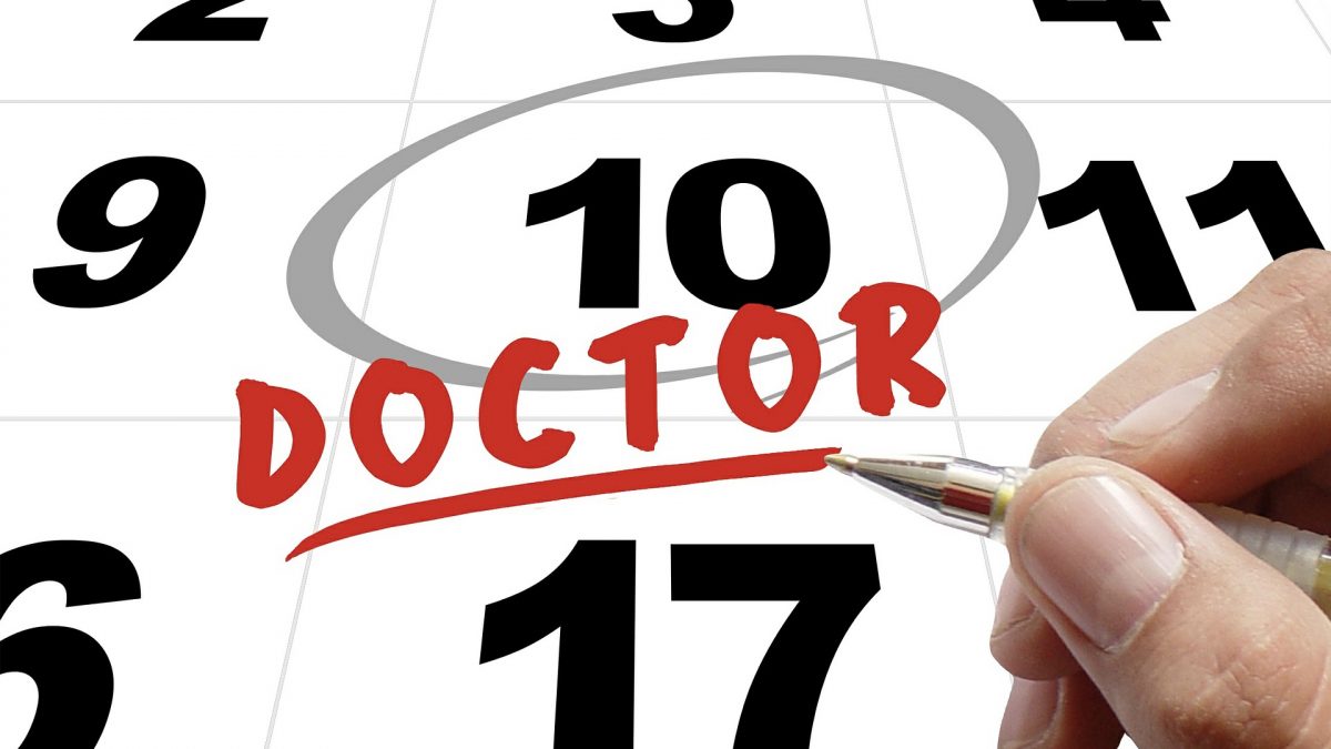 calendar with date circled and "doctor" written on it