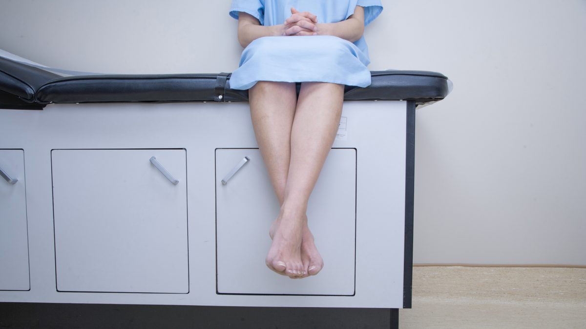 person sitting on an examination table