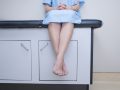 person sitting on an examination table