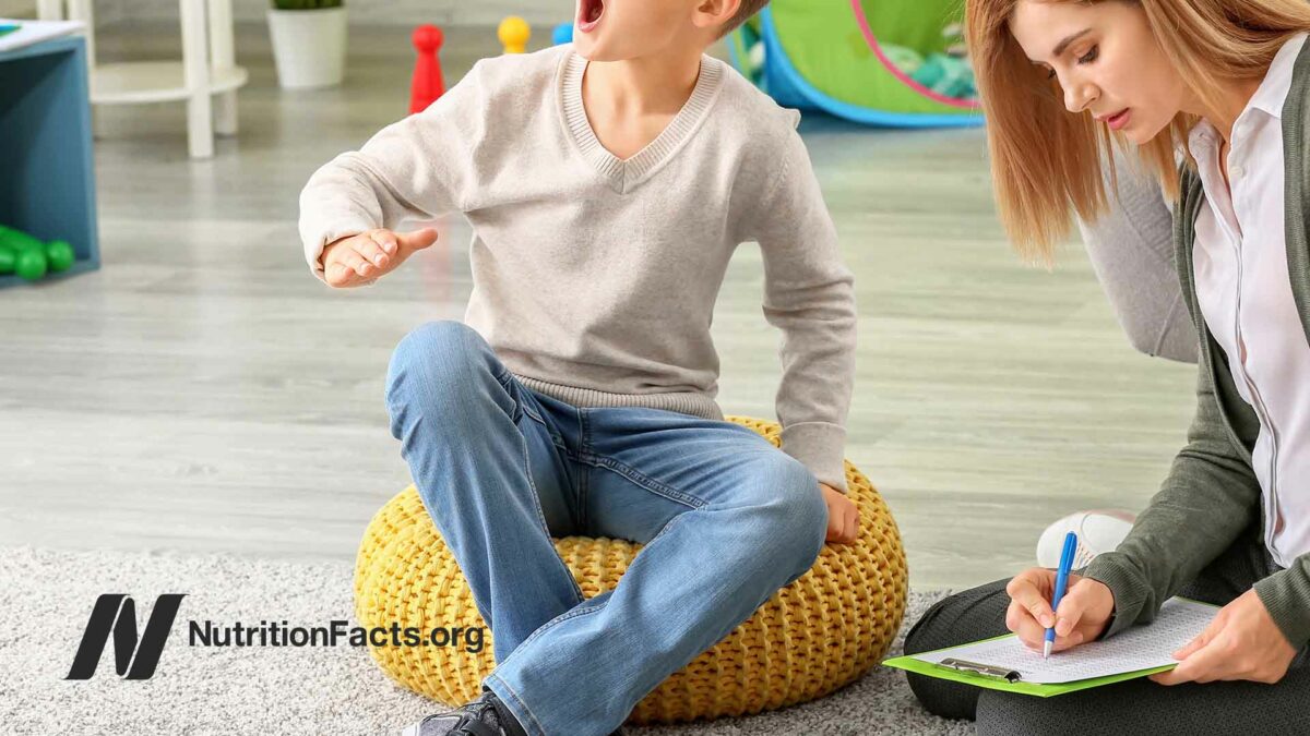 child sitting on a bean bag in a therapy session