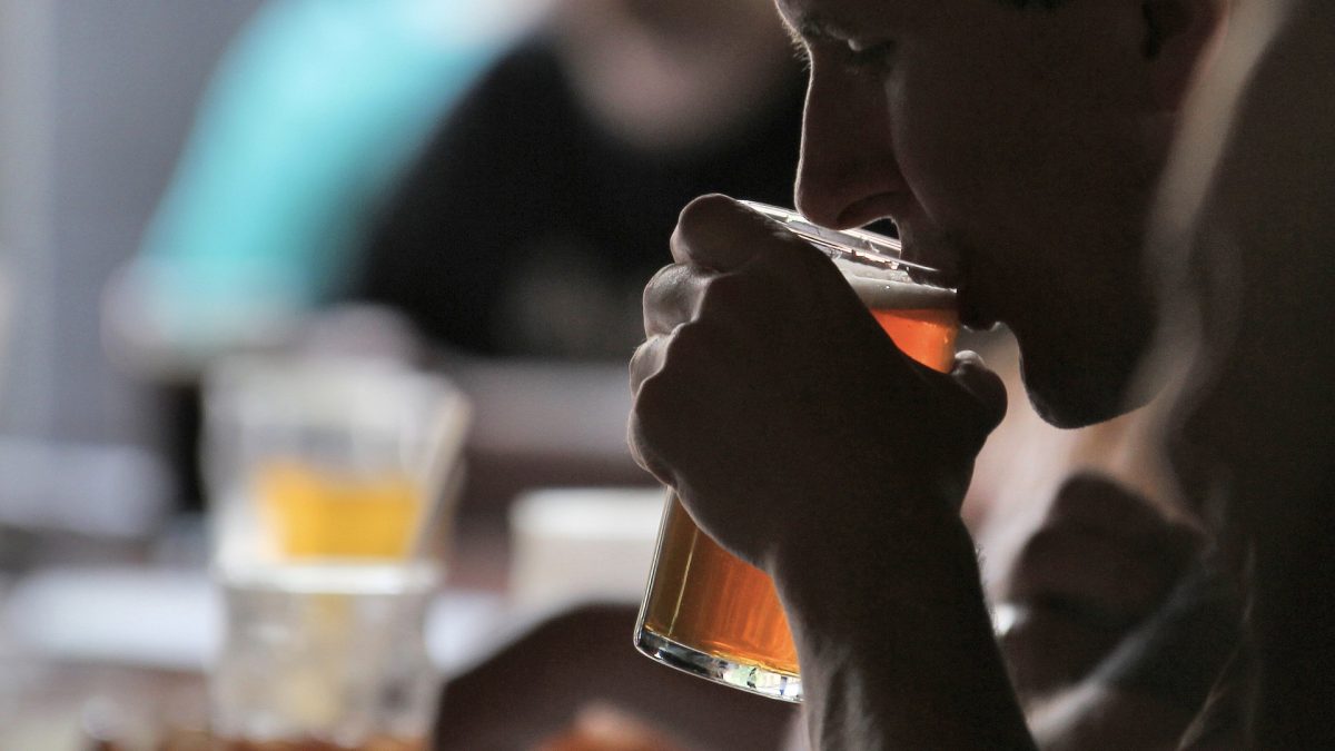 person drinking beer