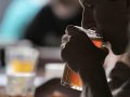 person drinking beer