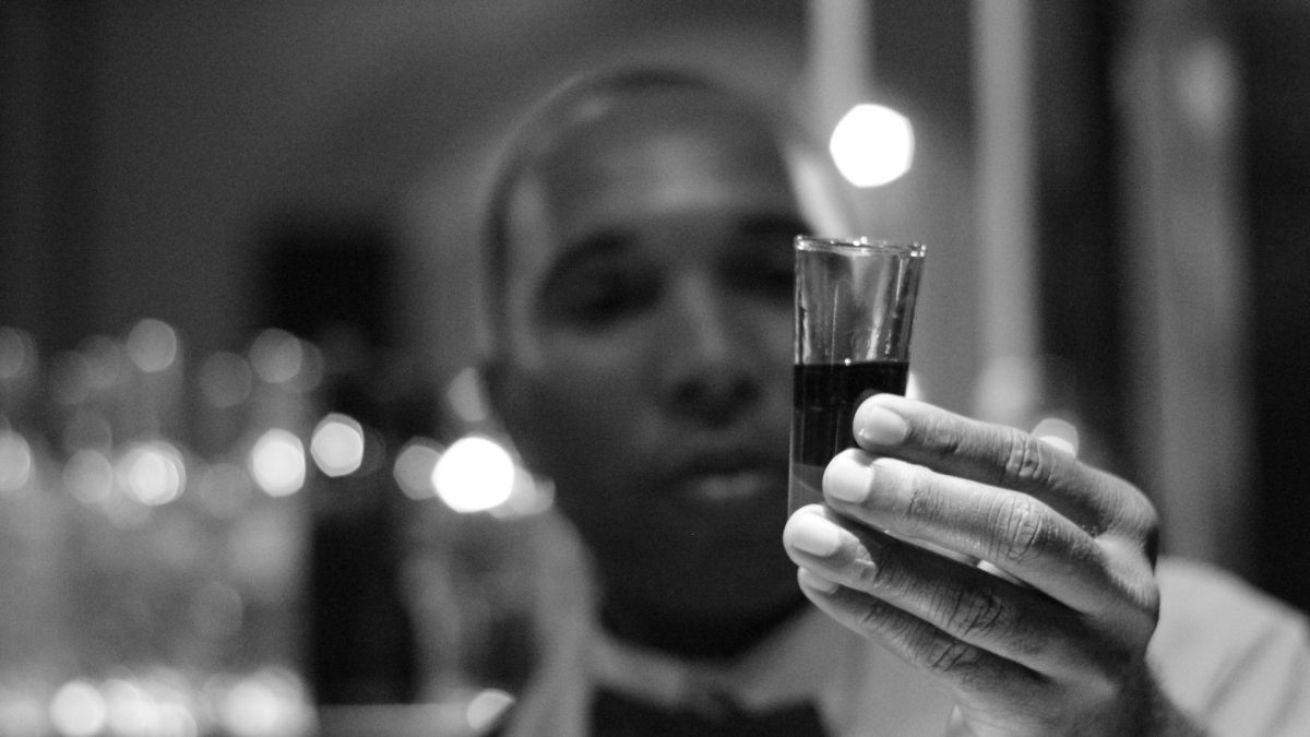 person holding a shot glass