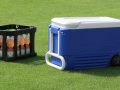 crate of sports drinks next to a cooler box