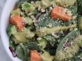 salad topped with caesar dressing and hemp seeds