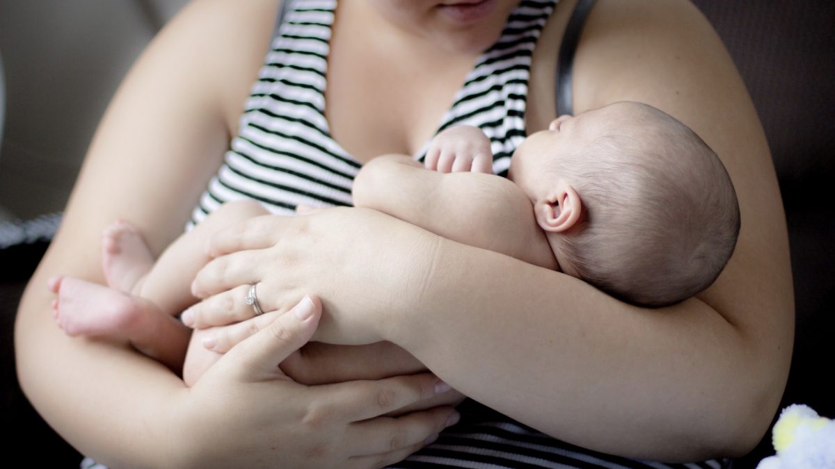 mother holding a baby