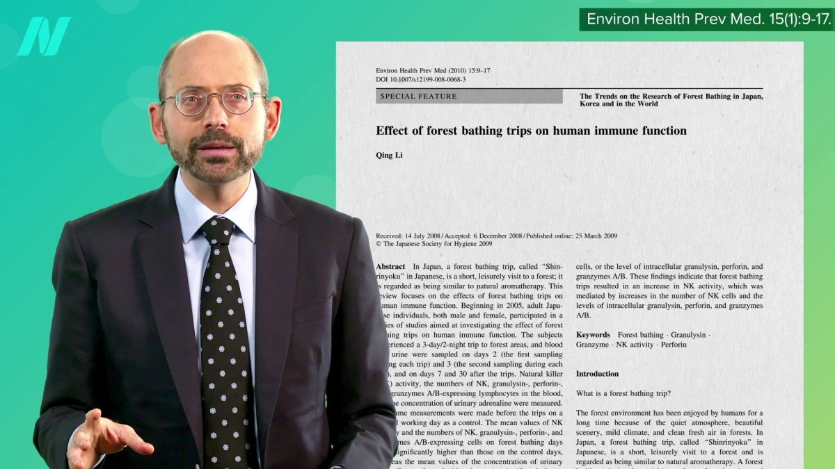 Dr. Greger in front of an excerpt from a study
