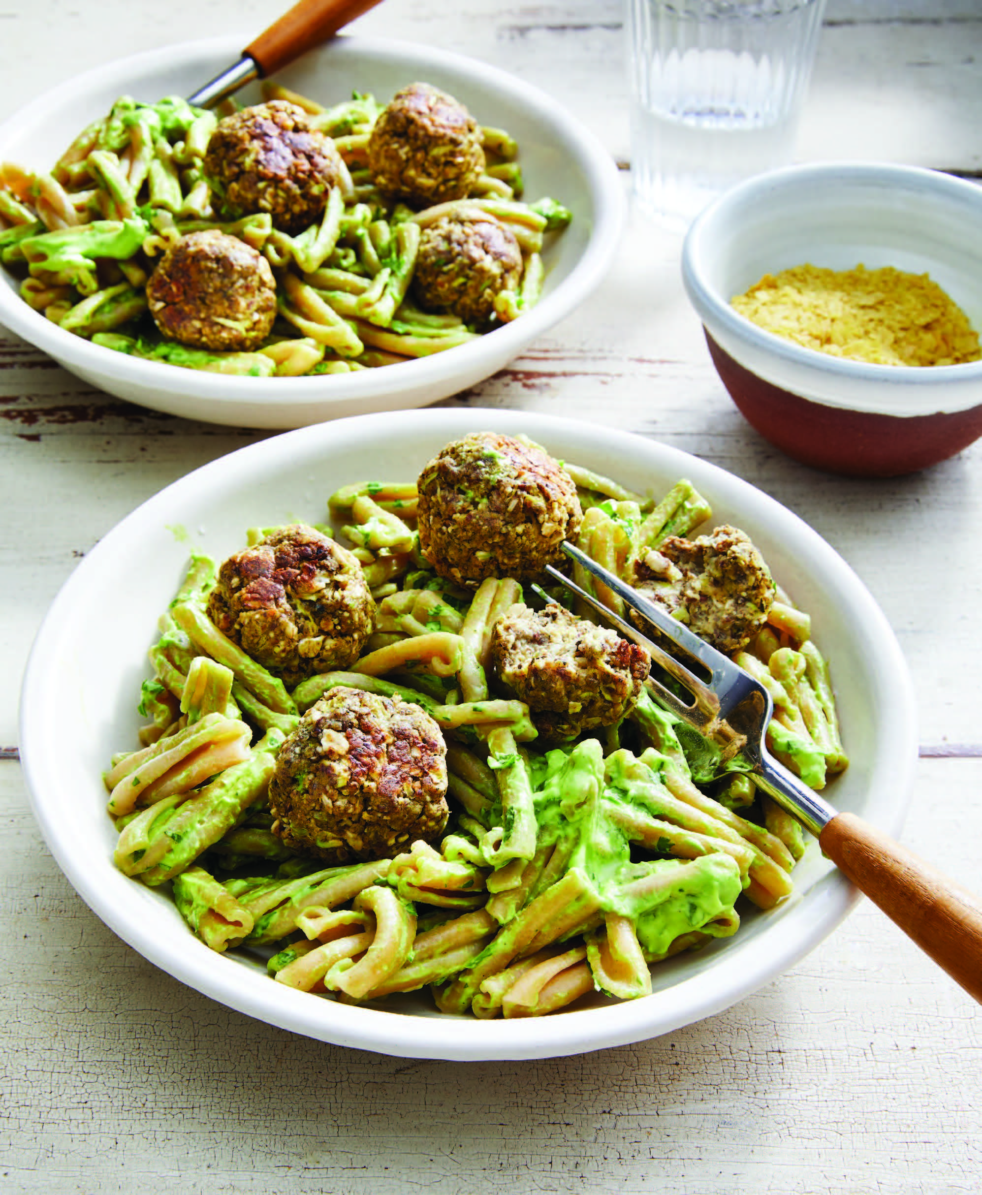 two bowls of gemelli with plant-based meatballs