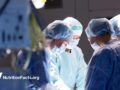 group of surgeons in operating room at hospital