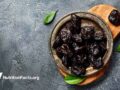Dried prunes on plate