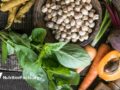 Large collection of the healthy foods including spinach, garbanzo beans, carrots, beets, ginger.