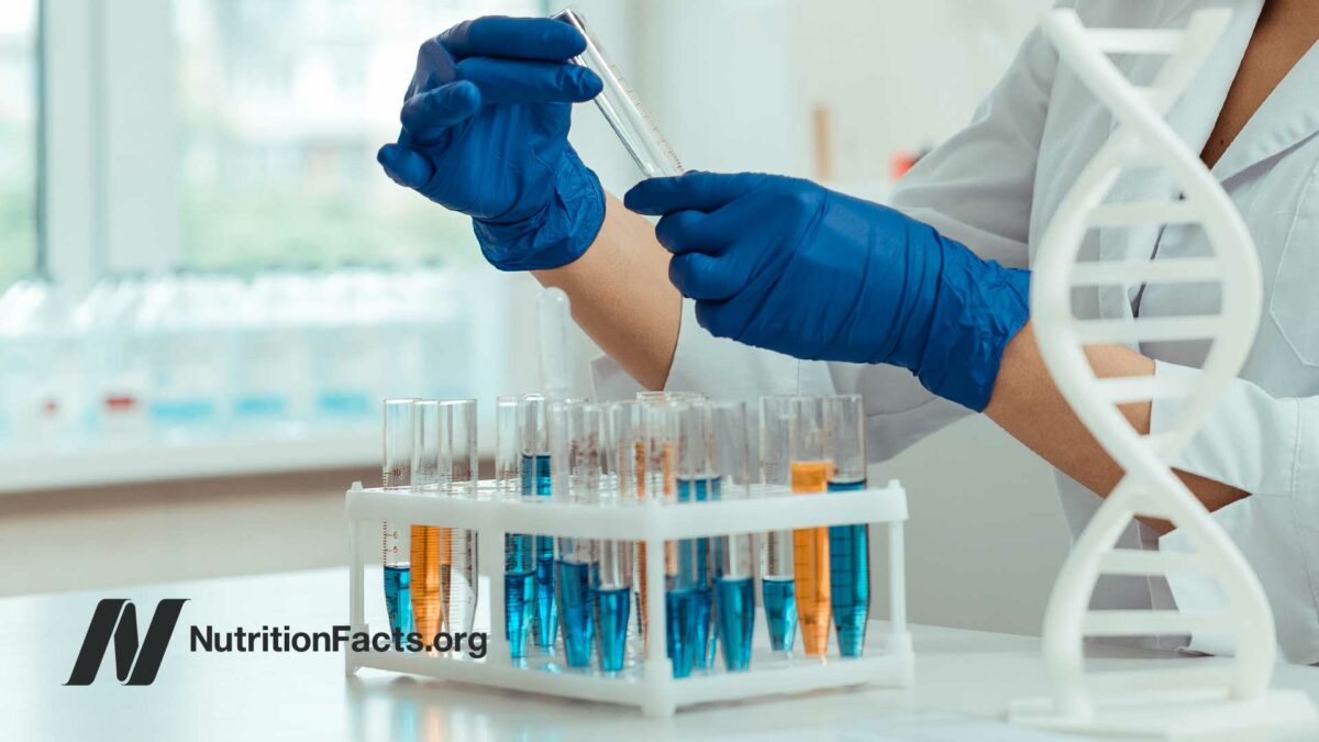 scientist considering test tubes