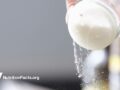 close up of salt shaker with salt pouring out