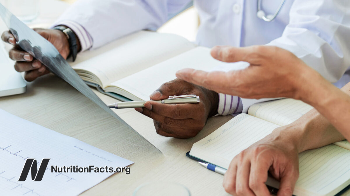 two doctors discussing documents