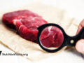 raw beef with magnifying glass