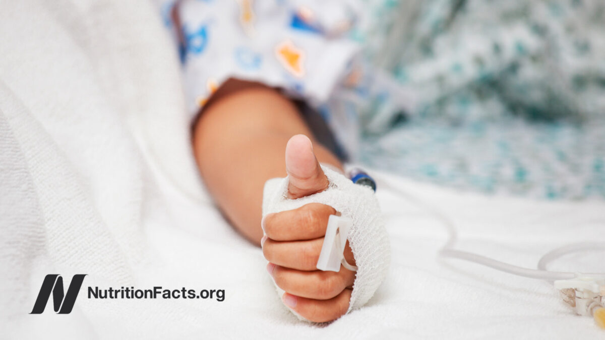 Thumbs up from patient in hospital bed