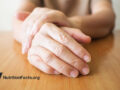 Hands on wooden table