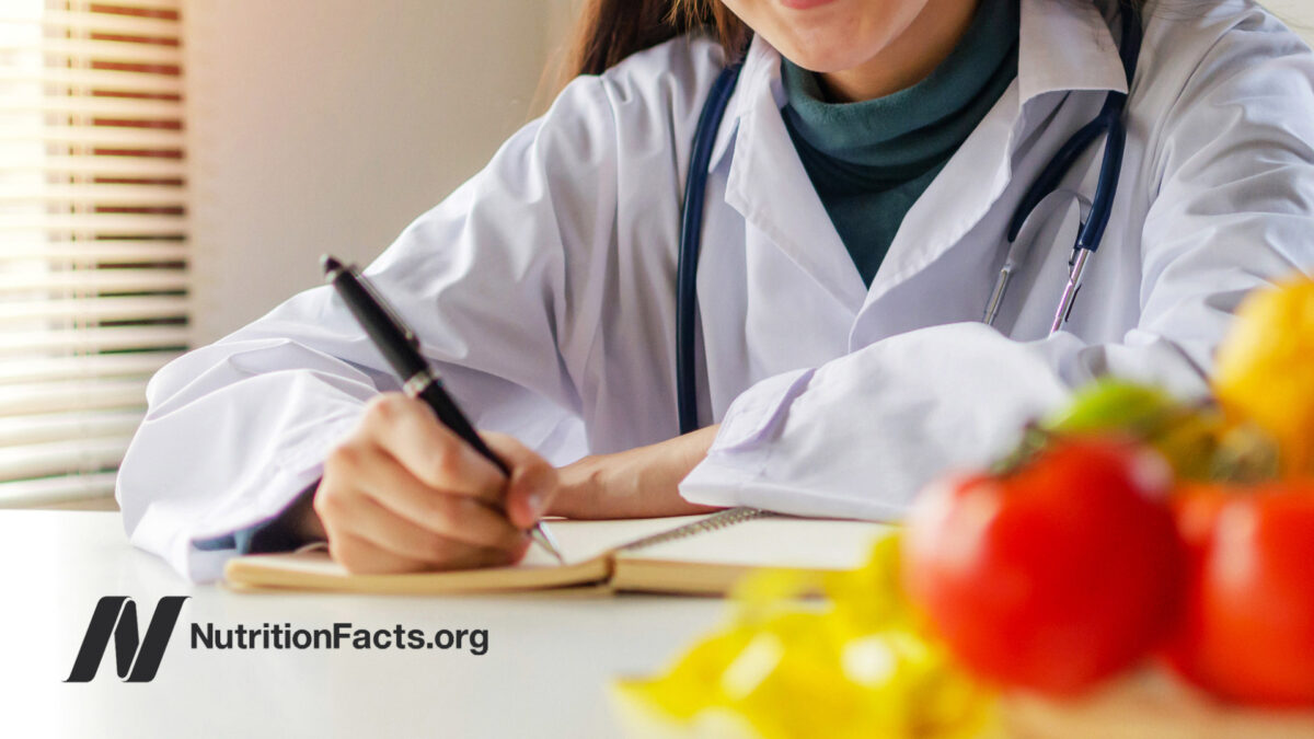 Medical professional writing in notebook