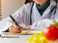 Medical professional writing in notebook