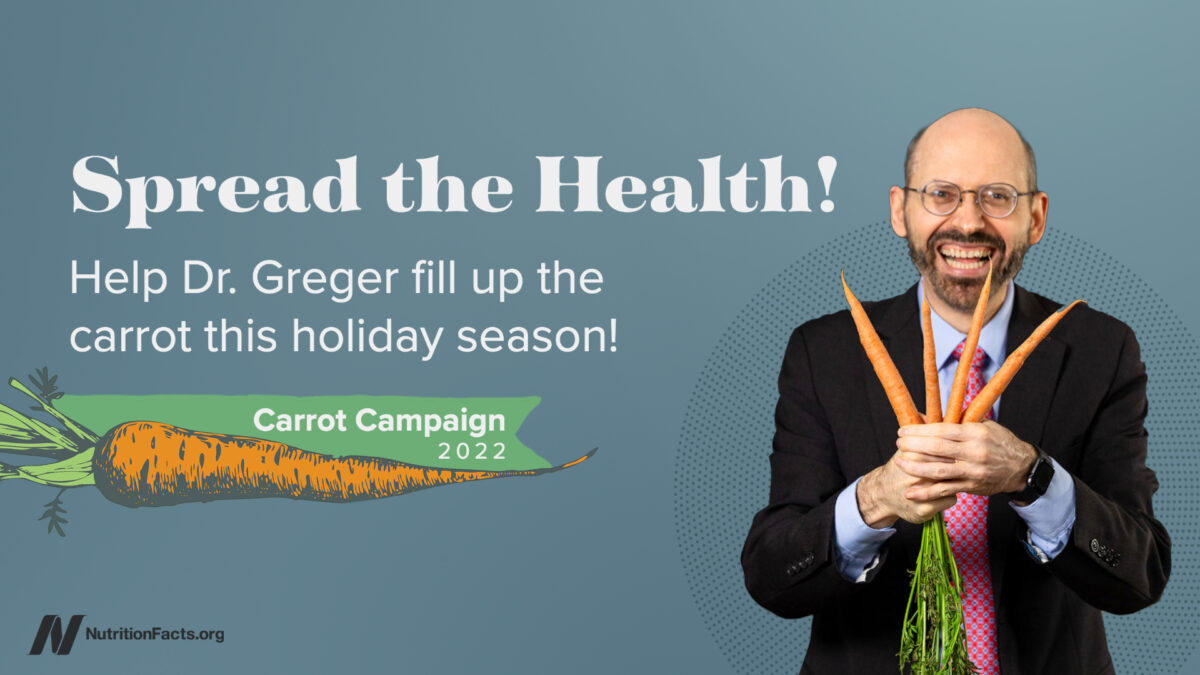 Spread the Health with a photo of Dr. Greger holding carrots