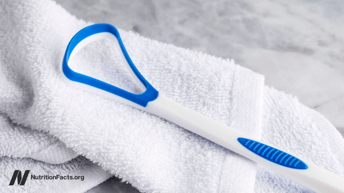 Tongue scraper on a white towel