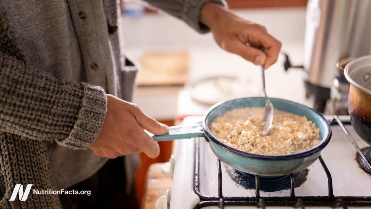 Person cooking oats on stovetop