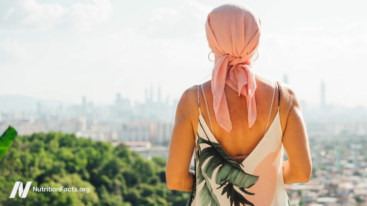 Person with a head wrap staring off into a beautiful distance